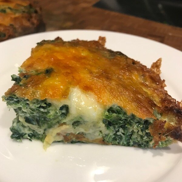 Sliced frittata showing texture and filling
